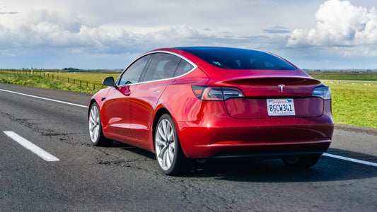 March 20, 2019 Los Angeles / CA / USA - Red Tesla Model 3 driving on the freeway
